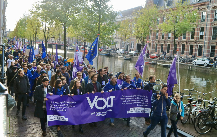 Volt parade in Amsterdam with flag